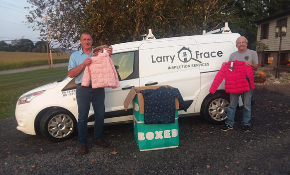 Larry Frace, CMI®, and some of the coats that were delivered to children in Berwick, Penn.